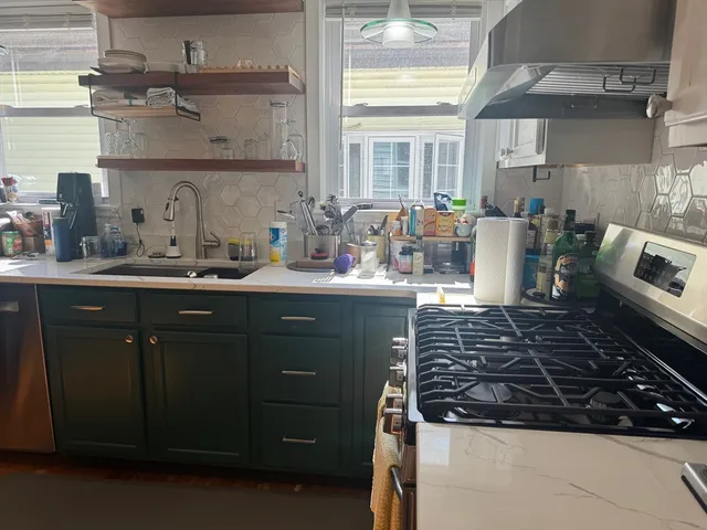 a kitchen with a sink and cabinets