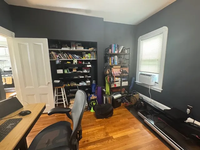 a room with gym equipment and a window