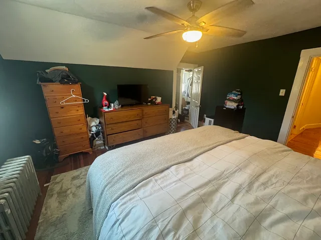 a bed room with a bed and a chandelier