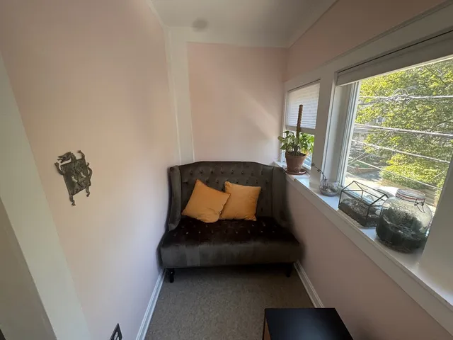 a living room with a couch and a window