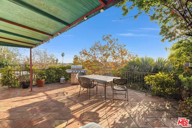 a house view with a sitting space and garden view