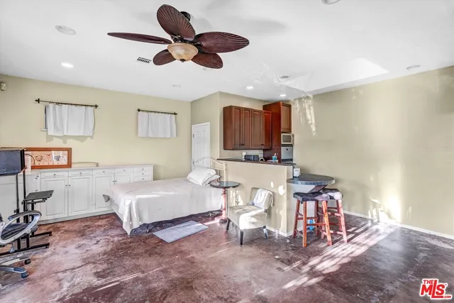 a kitchen with stainless steel appliances granite countertop a refrigerator sink and cabinets