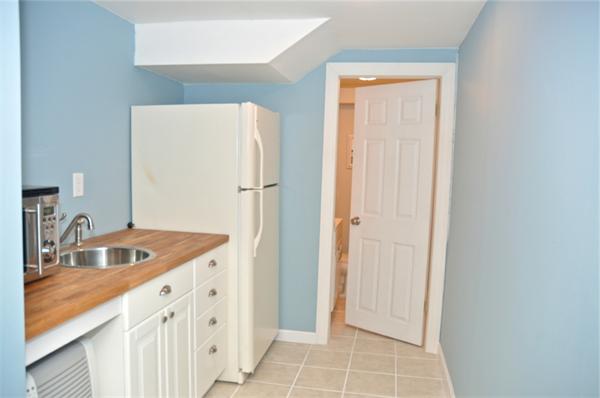 331 Goldthwaite Road Northbridge, MA 01588 - Photo 21 of 23 a kitchen with a sink and a refrigerator