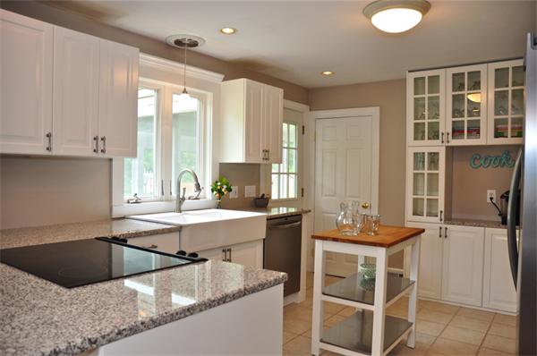 331 Goldthwaite Road Northbridge, MA 01588 - Photo 3 of 23 a kitchen with a sink stove and cabinets