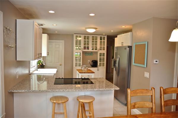 331 Goldthwaite Road Northbridge, MA 01588 - Photo 4 of 23 a kitchen with stainless steel appliances granite countertop sink refrigerator and microwave