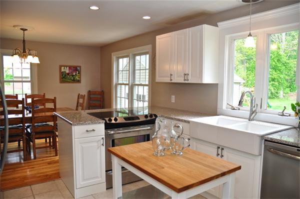 331 Goldthwaite Road Northbridge, MA 01588 - Photo 6 of 23 a kitchen with a sink a window and chairs