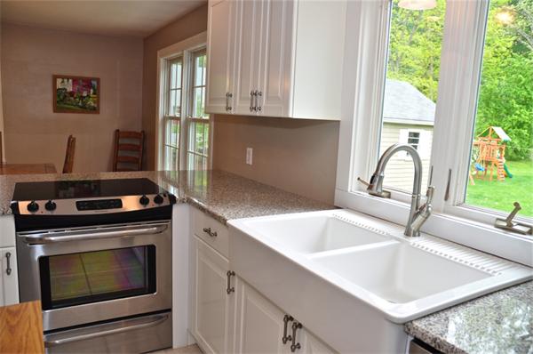331 Goldthwaite Road Northbridge, MA 01588 - Photo 7 of 23 a kitchen with granite countertop a stove and a sink