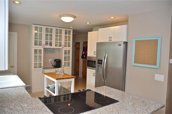 331 Goldthwaite Road Northbridge, MA 01588 - Photo 8 of 23 a kitchen with stainless steel appliances kitchen island granite countertop a refrigerator a stove and a sink