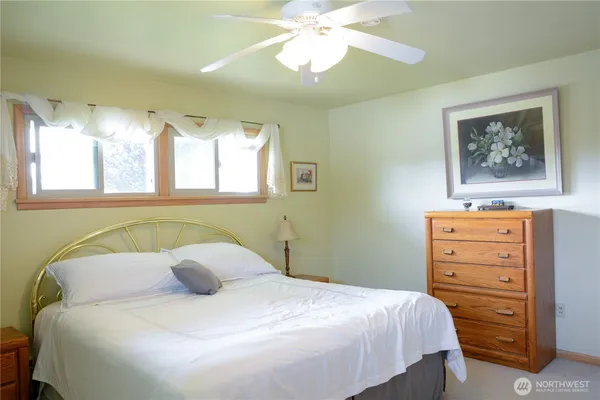 a bedroom with a bed and a dresser
