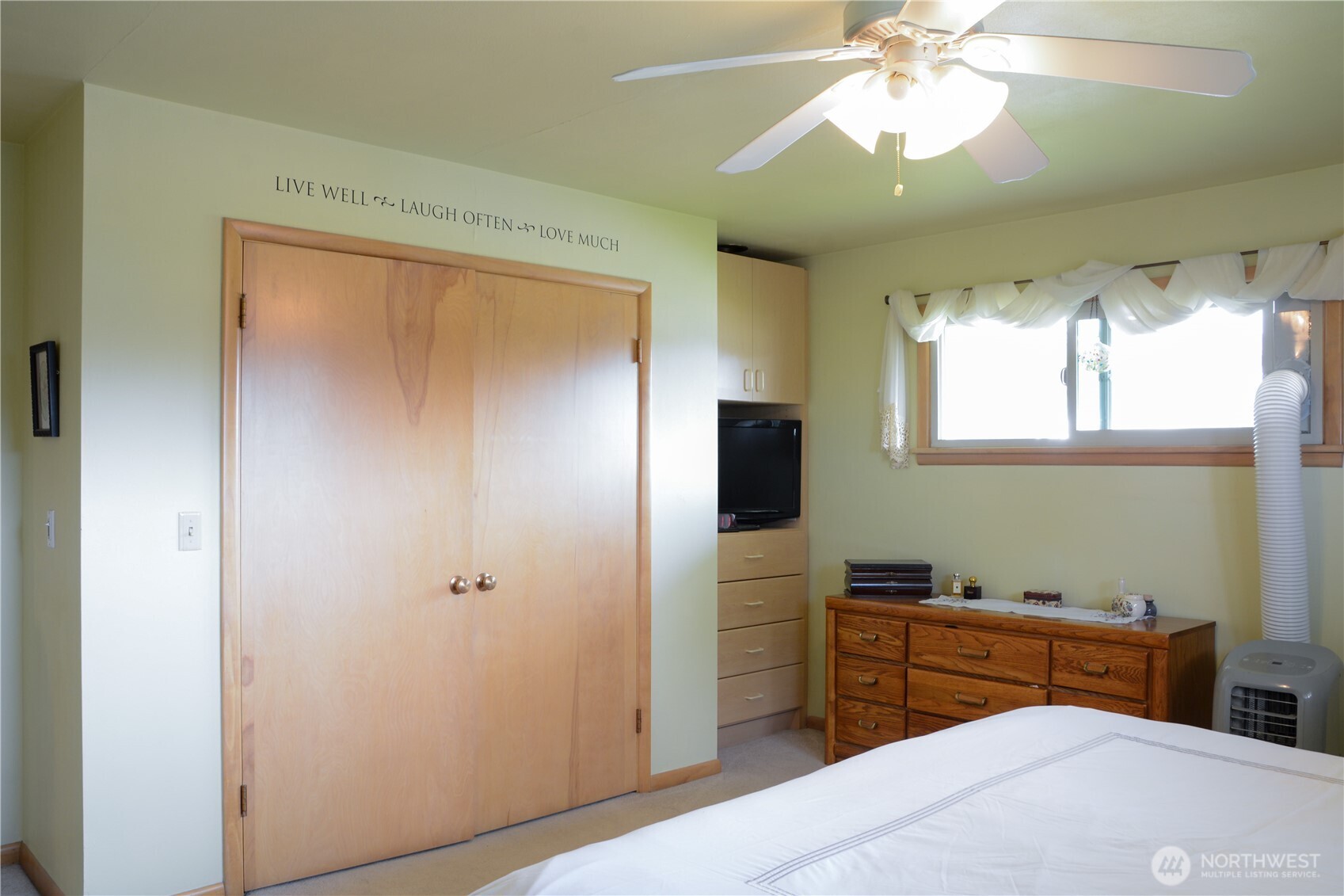 310 West 9th Avenue Ritzville, WA 99169 - Photo 13 of 38 a bedroom with a bed and a chandelier