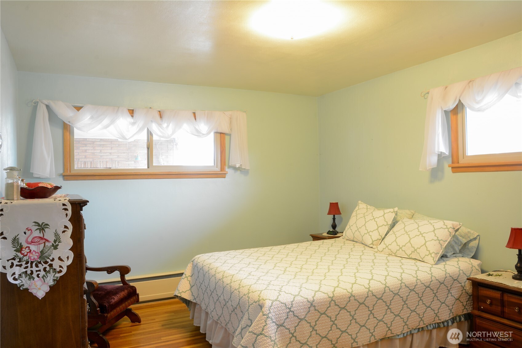 310 West 9th Avenue Ritzville, WA 99169 - Photo 15 of 38 a bedroom with a bed and wooden floor