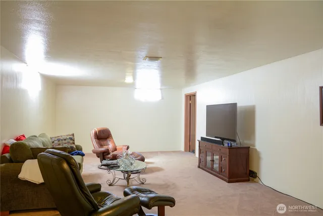 a room with furniture and a flat screen tv