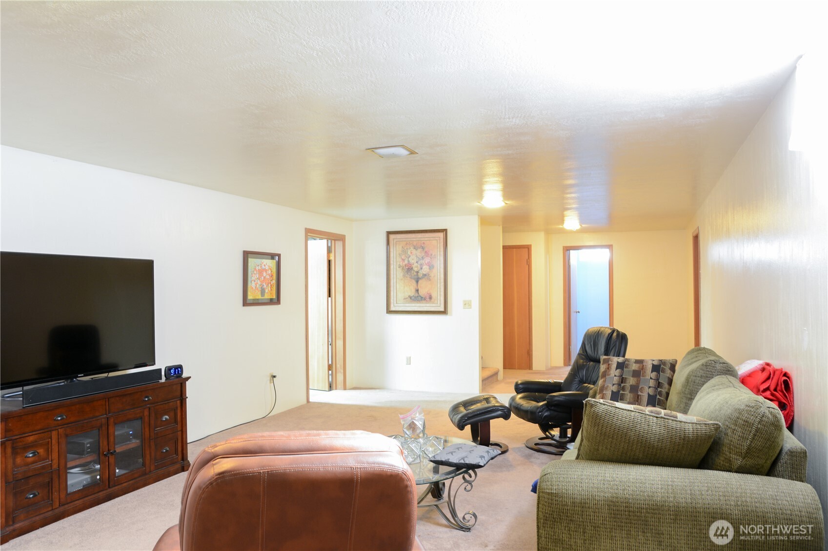 310 West 9th Avenue Ritzville, WA 99169 - Photo 21 of 38 a living room with furniture and a flat screen tv