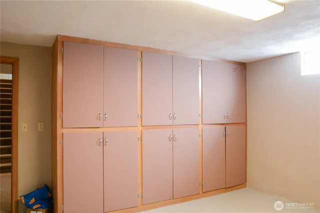 a view of a closet area with an empty room