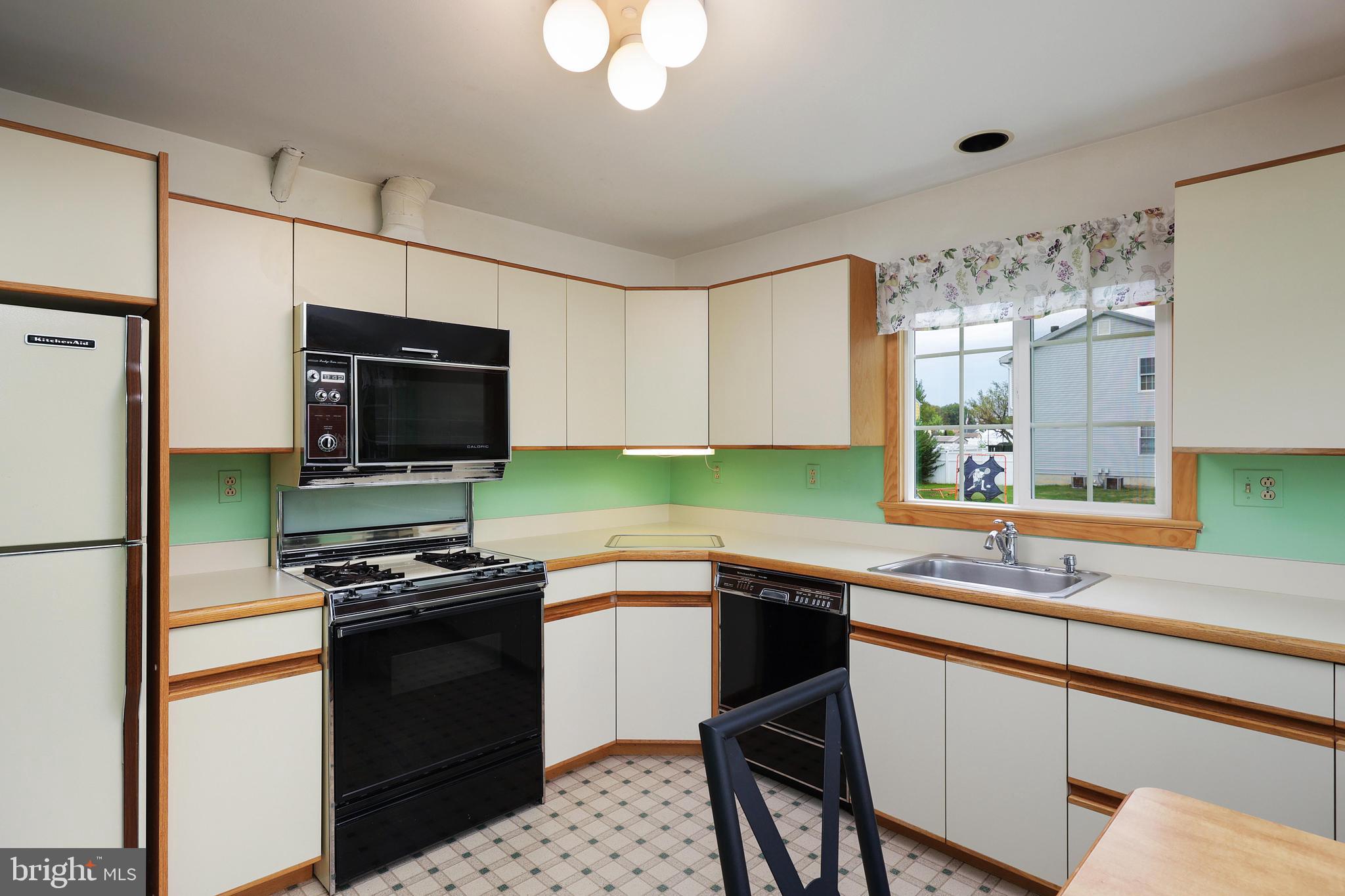 81 Falmouth Road Hamilton, NJ 08620 - Photo 11 of 26 a kitchen with a sink appliances and cabinets