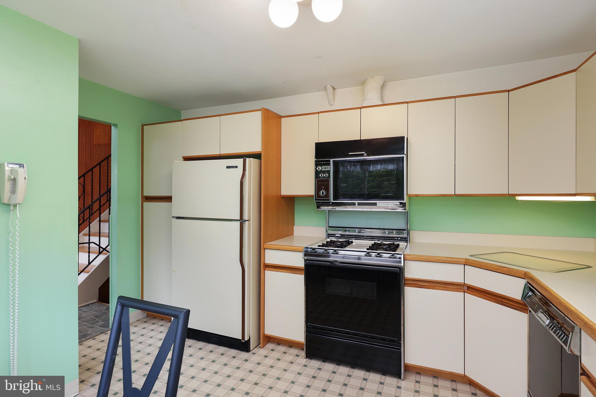 81 Falmouth Road Hamilton, NJ 08620 - Photo 12 of 26 a kitchen with stainless steel appliances a refrigerator stove and microwave