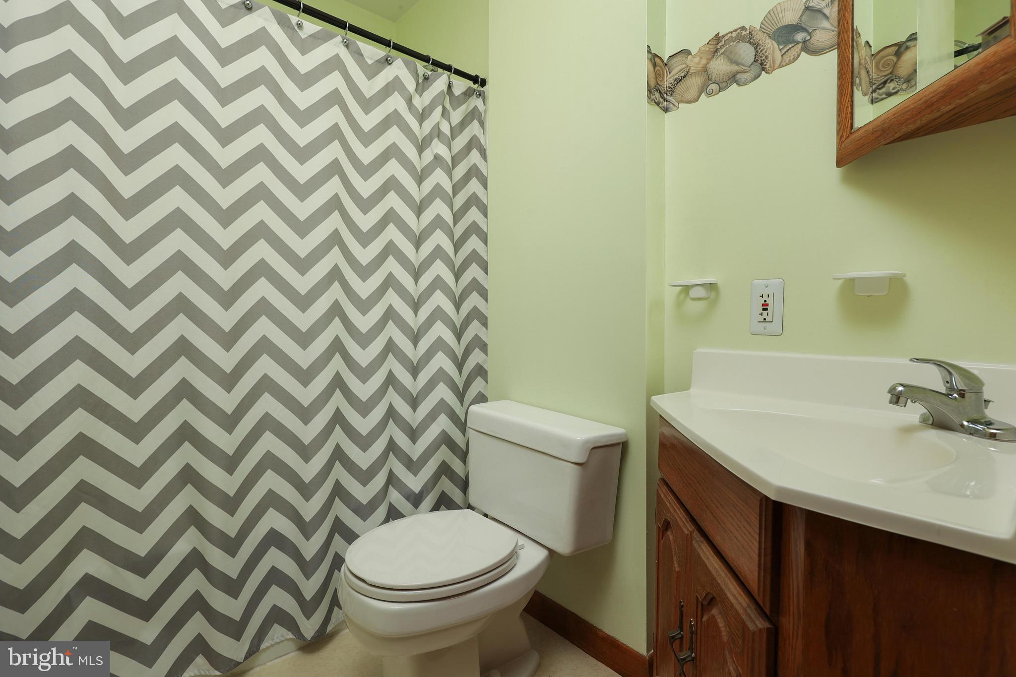81 Falmouth Road Hamilton, NJ 08620 - Photo 16 of 26 a bathroom with a sink and a toilet