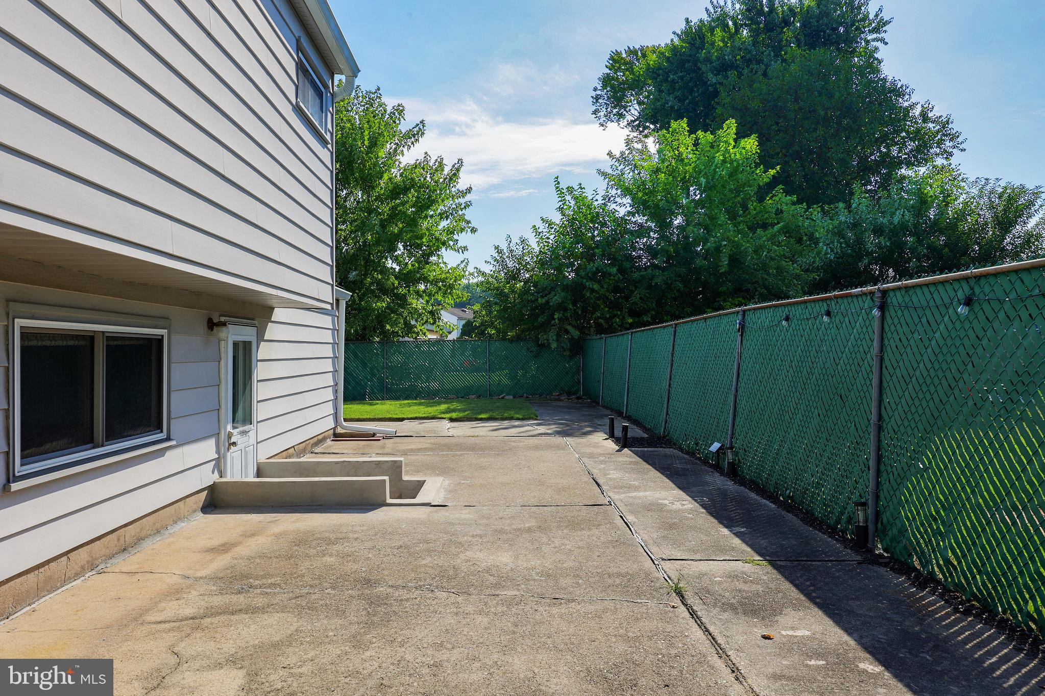 81 Falmouth Road Hamilton, NJ 08620 - Photo 21 of 26 a backyard of a house with lots of green space