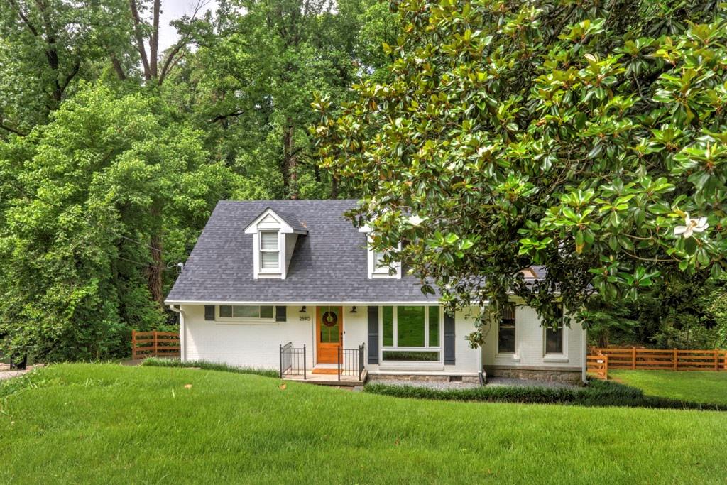 2590 Ridgemore Road Northwest Atlanta, GA 30318 - Photo 1 of 1 front view of a house with a yard
