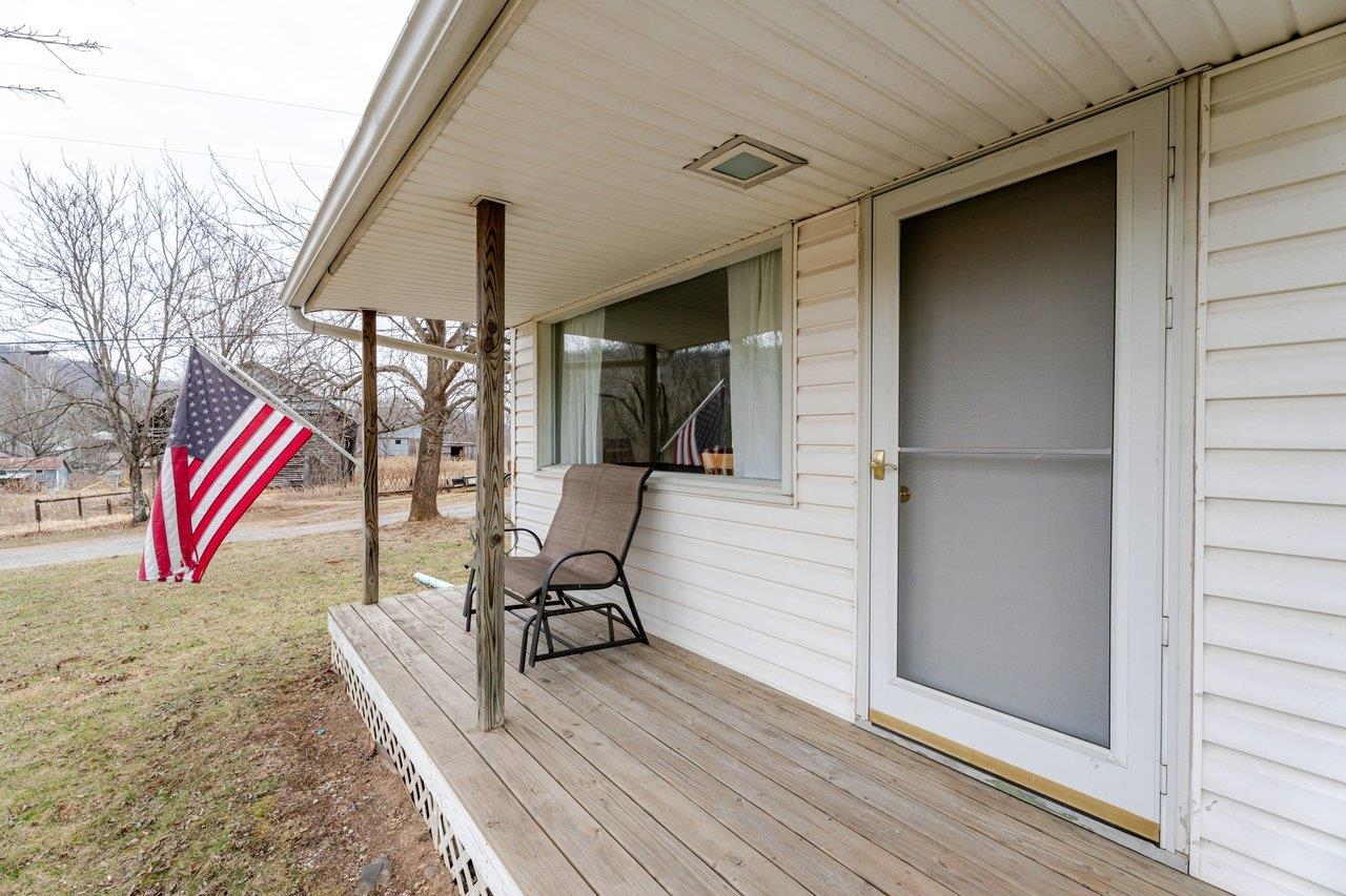 11918 Turleytown Road Broadway, VA 22815 - Photo 2 of 42 a balcony with chairs and wooden floor