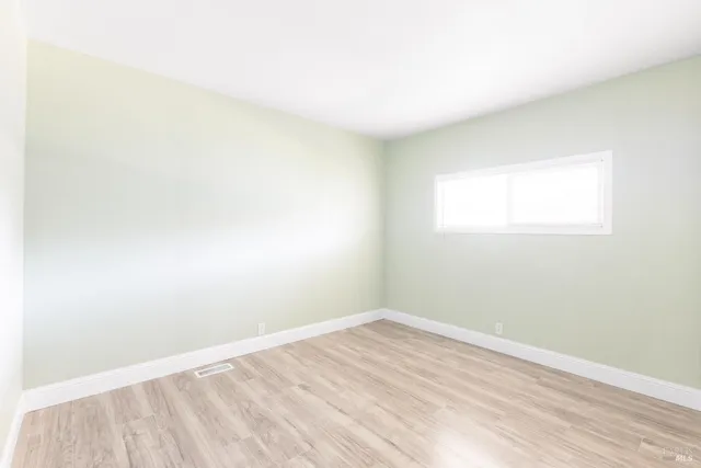 a bathroom with a bathtub sink vanity and mirror