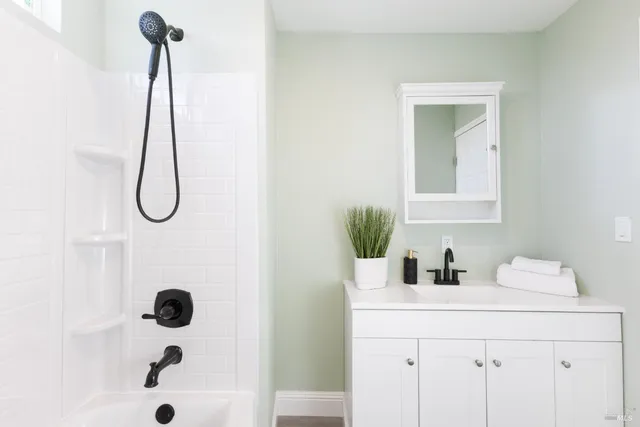 an empty room with wooden floor and a window