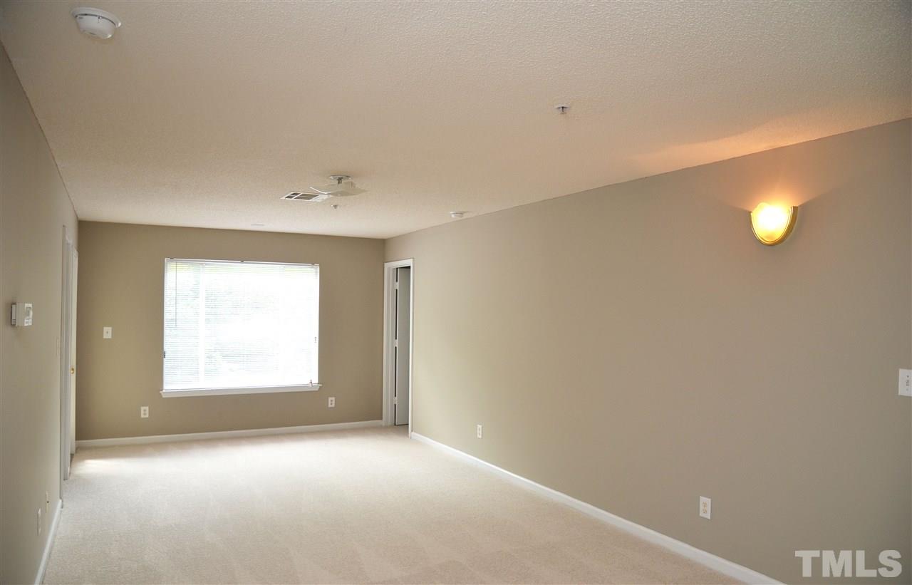 1500 Graduate Lane, Unit 204 Raleigh, NC 27606 - Photo 12 of 23 a view of an empty room with a window and a bathroom