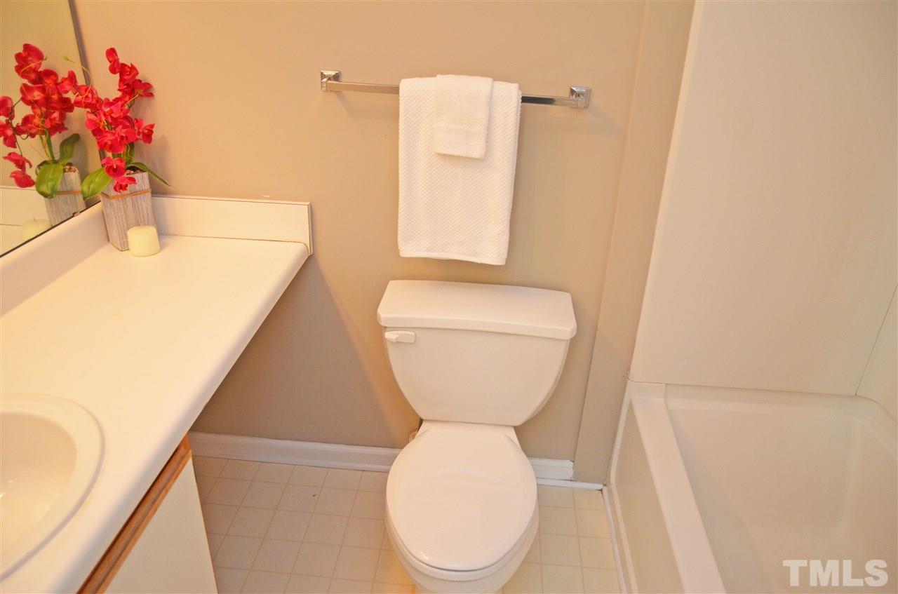 1500 Graduate Lane, Unit 204 Raleigh, NC 27606 - Photo 22 of 23 a bathroom with a toilet sink and mirror