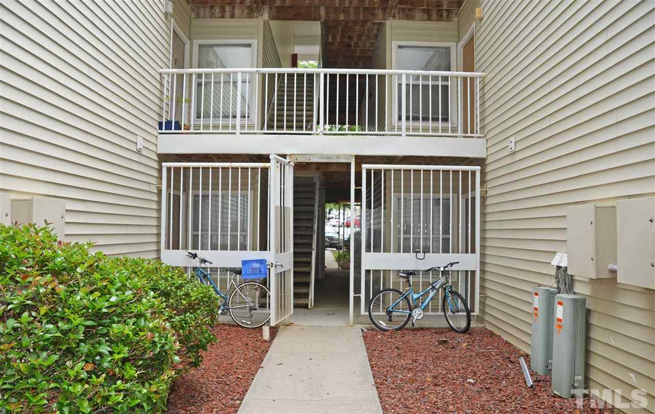 1500 Graduate Lane, Unit 204 Raleigh, NC 27606 - Photo 3 of 23 a view of a house with a small deck and a garden