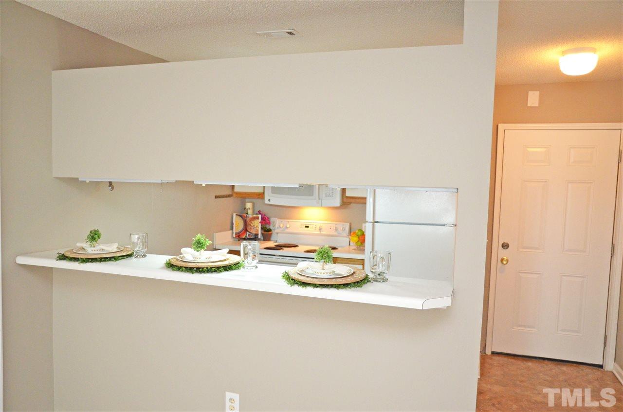 1500 Graduate Lane, Unit 204 Raleigh, NC 27606 - Photo 9 of 23 a kitchen with a sink and cabinets