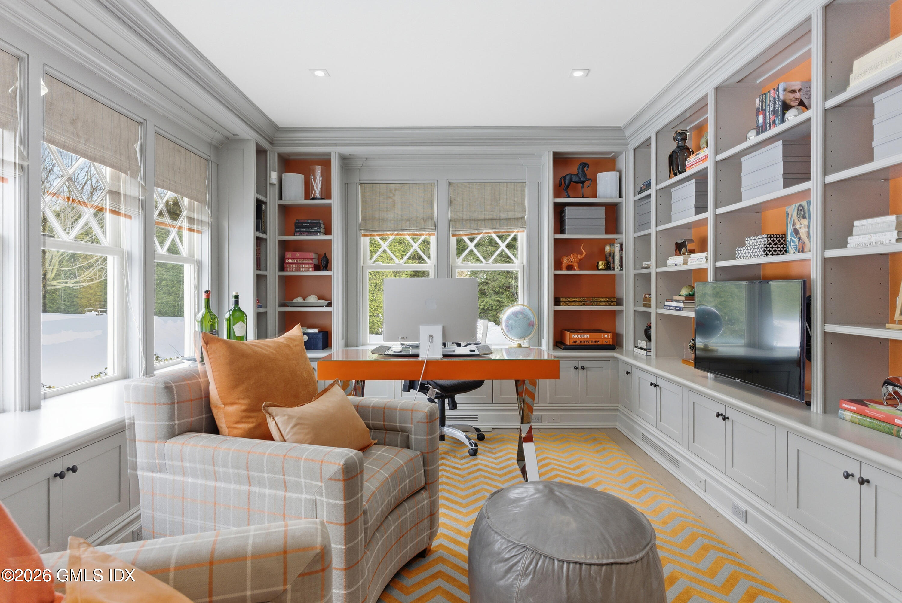 212 Bedford Road Greenwich, CT 06831 - Photo 12 of 39 a living room with furniture a flat screen tv and large window