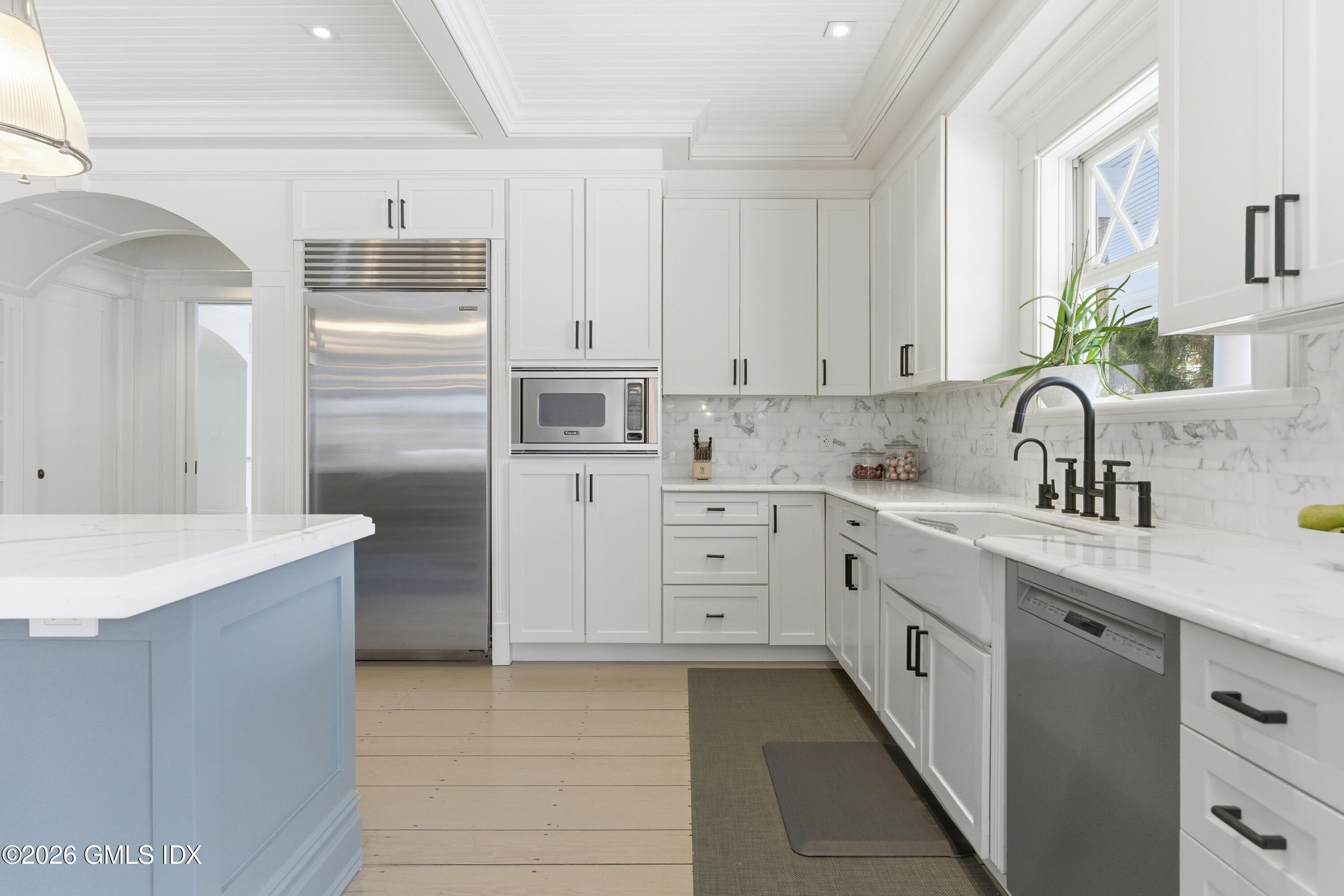 212 Bedford Road Greenwich, CT 06831 - Photo 14 of 39 a kitchen with cabinets appliances a sink and a counter top space