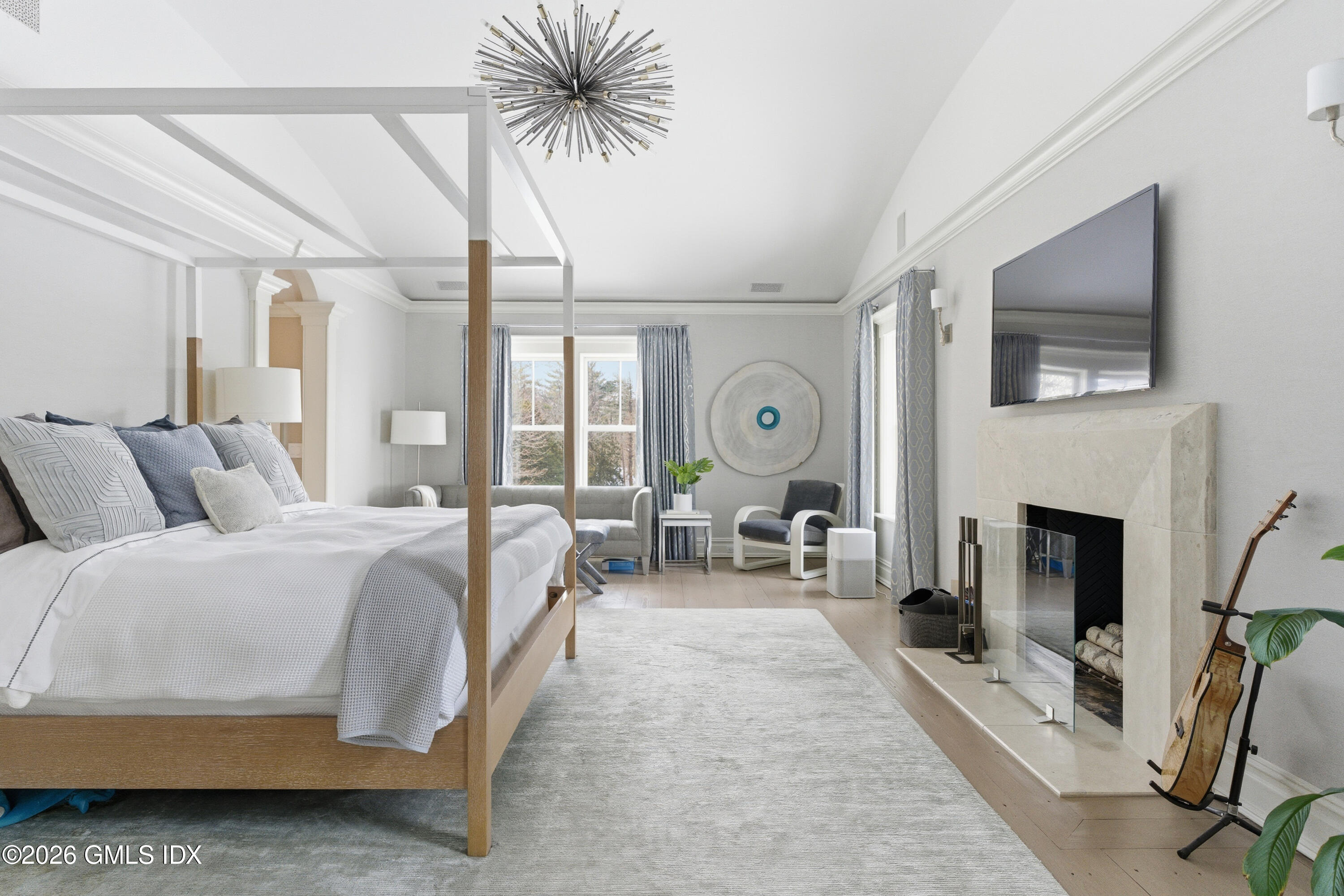 212 Bedford Road Greenwich, CT 06831 - Photo 20 of 39 a spacious bedroom with a balcony a bed and a fireplace