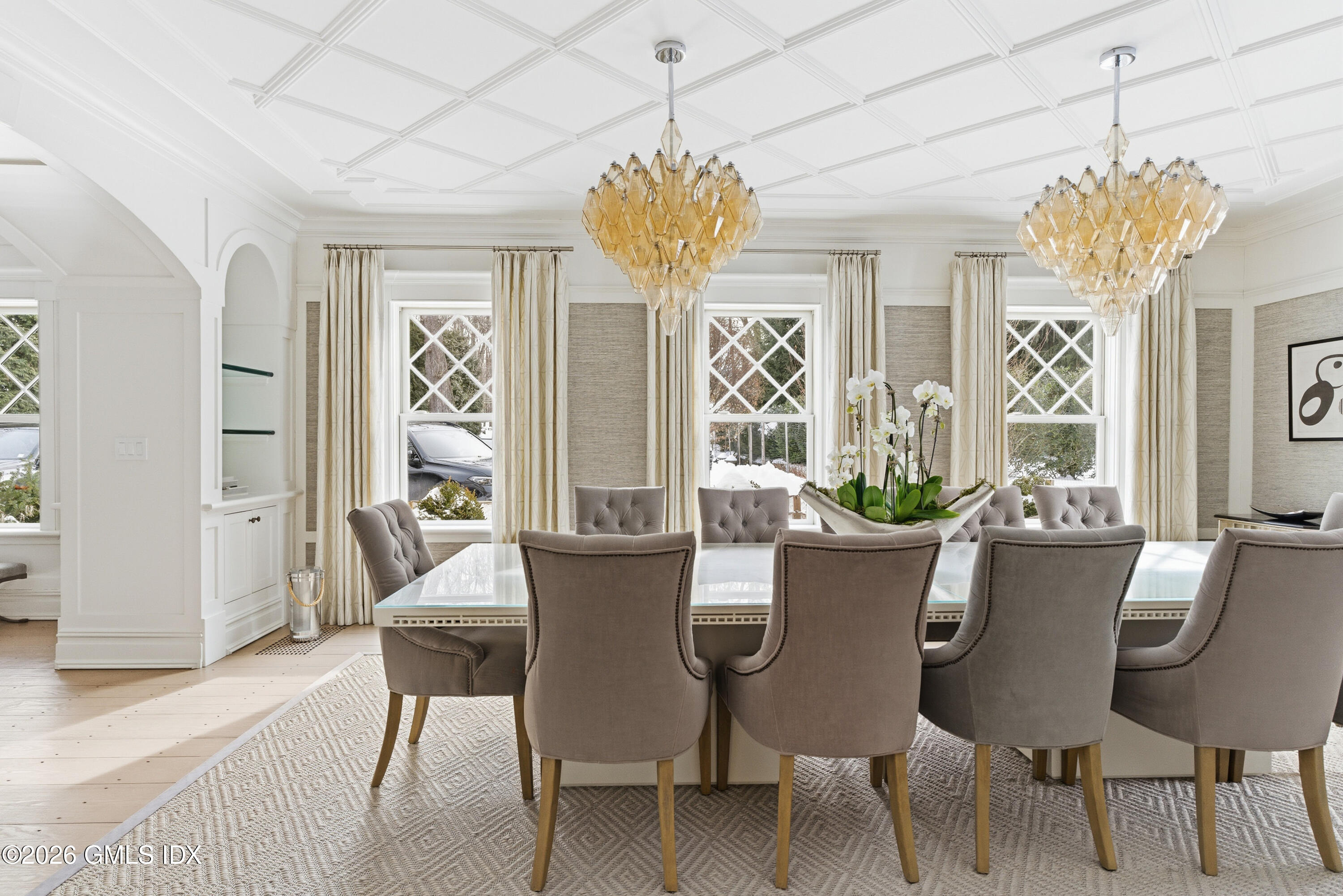 212 Bedford Road Greenwich, CT 06831 - Photo 10 of 39 a view of a dining room with furniture and a chandelier