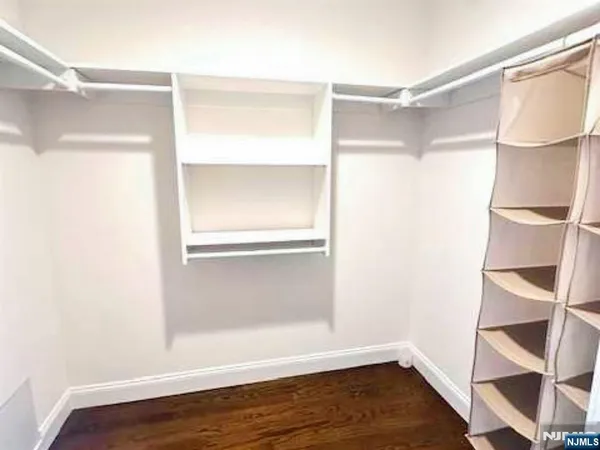 a view of an empty walk in closet