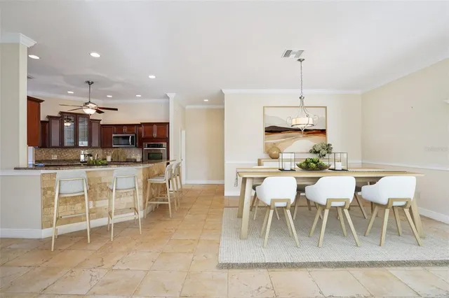 a view of kitchen with refrigerator and window