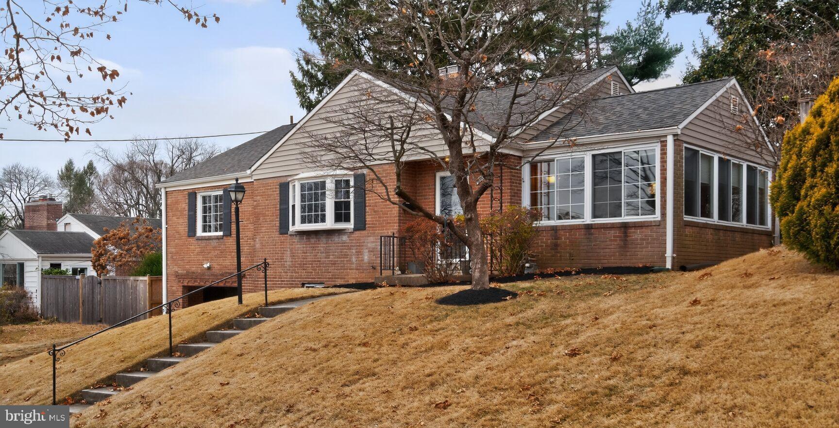 Charming hillside home with inviting curb appeal.