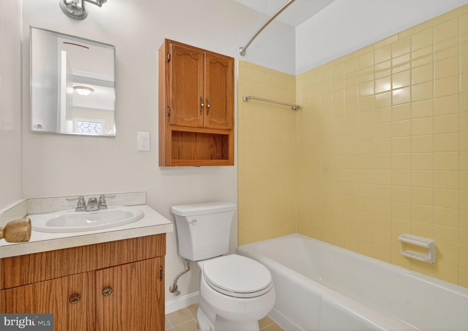 4503 Woodfield Road Kensington, MD 20895 - Photo 12 of 30 Charming bathroom with vintage tile accents.