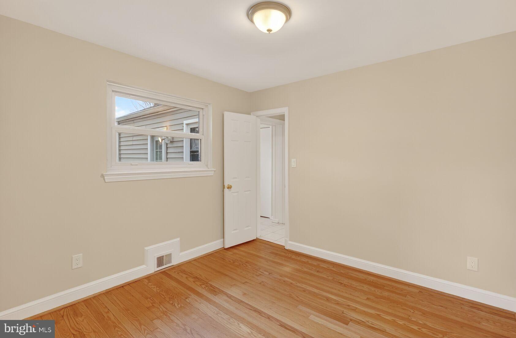 4503 Woodfield Road Kensington, MD 20895 - Photo 13 of 30 Bright and airy room with hardwood floors.