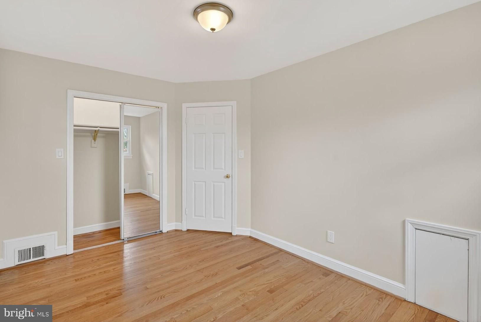 4503 Woodfield Road Kensington, MD 20895 - Photo 18 of 30 Bright and airy room with hardwood floors.