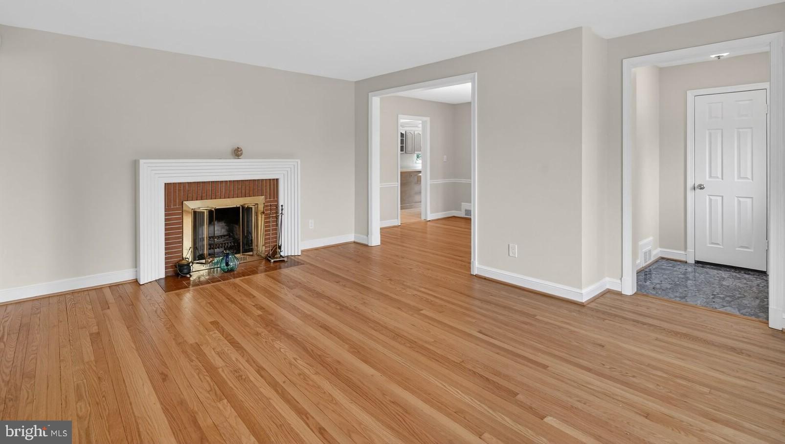 4503 Woodfield Road Kensington, MD 20895 - Photo 19 of 30 Spacious living area with elegant fireplace.