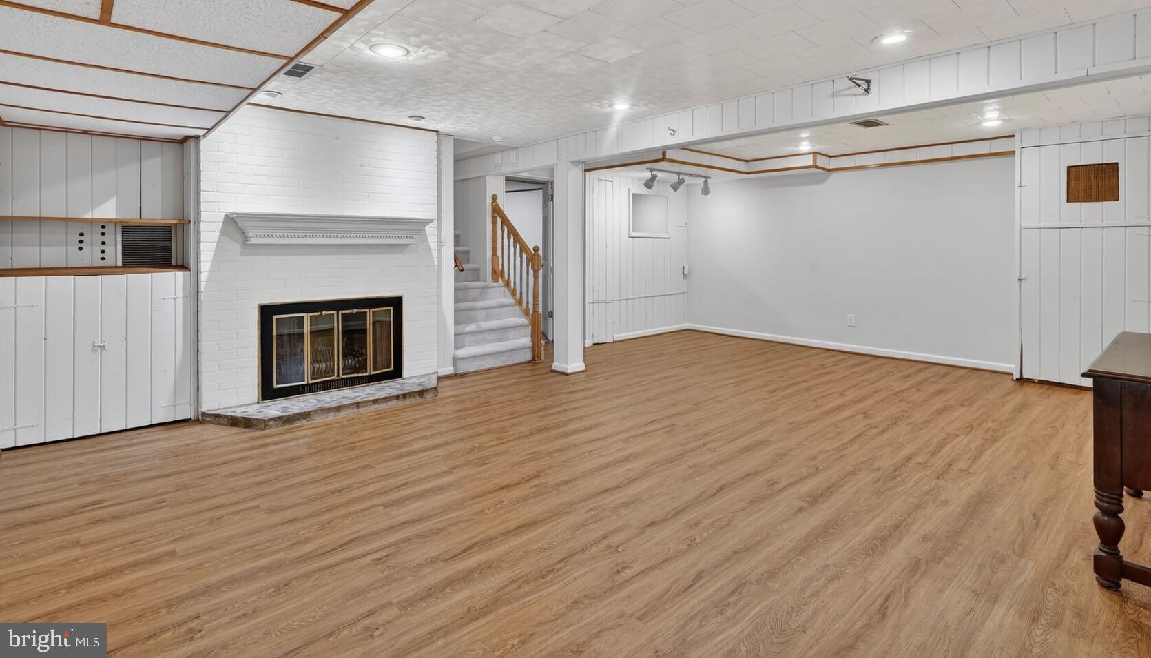 4503 Woodfield Road Kensington, MD 20895 - Photo 22 of 30 Spacious, versatile basement with cozy fireplace.