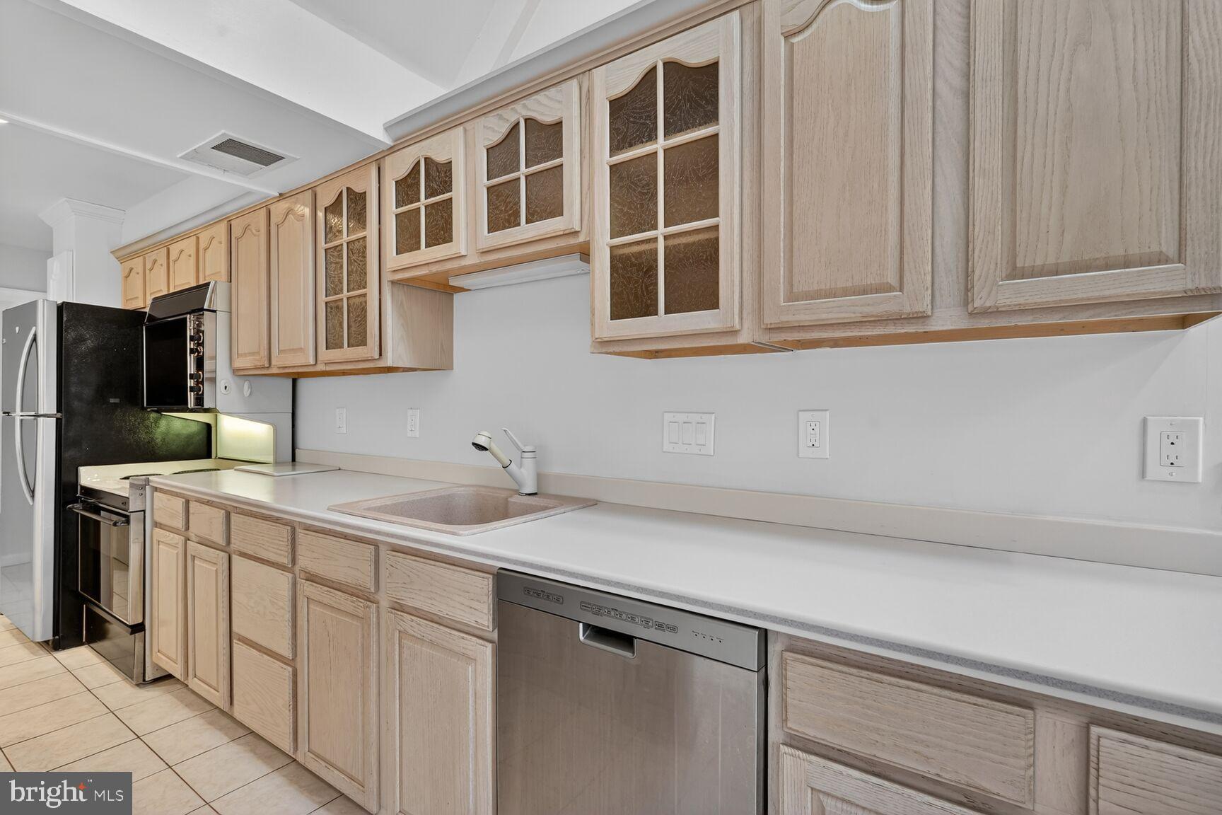 4503 Woodfield Road Kensington, MD 20895 - Photo 26 of 30 Bright and spacious kitchen with modern finishes.