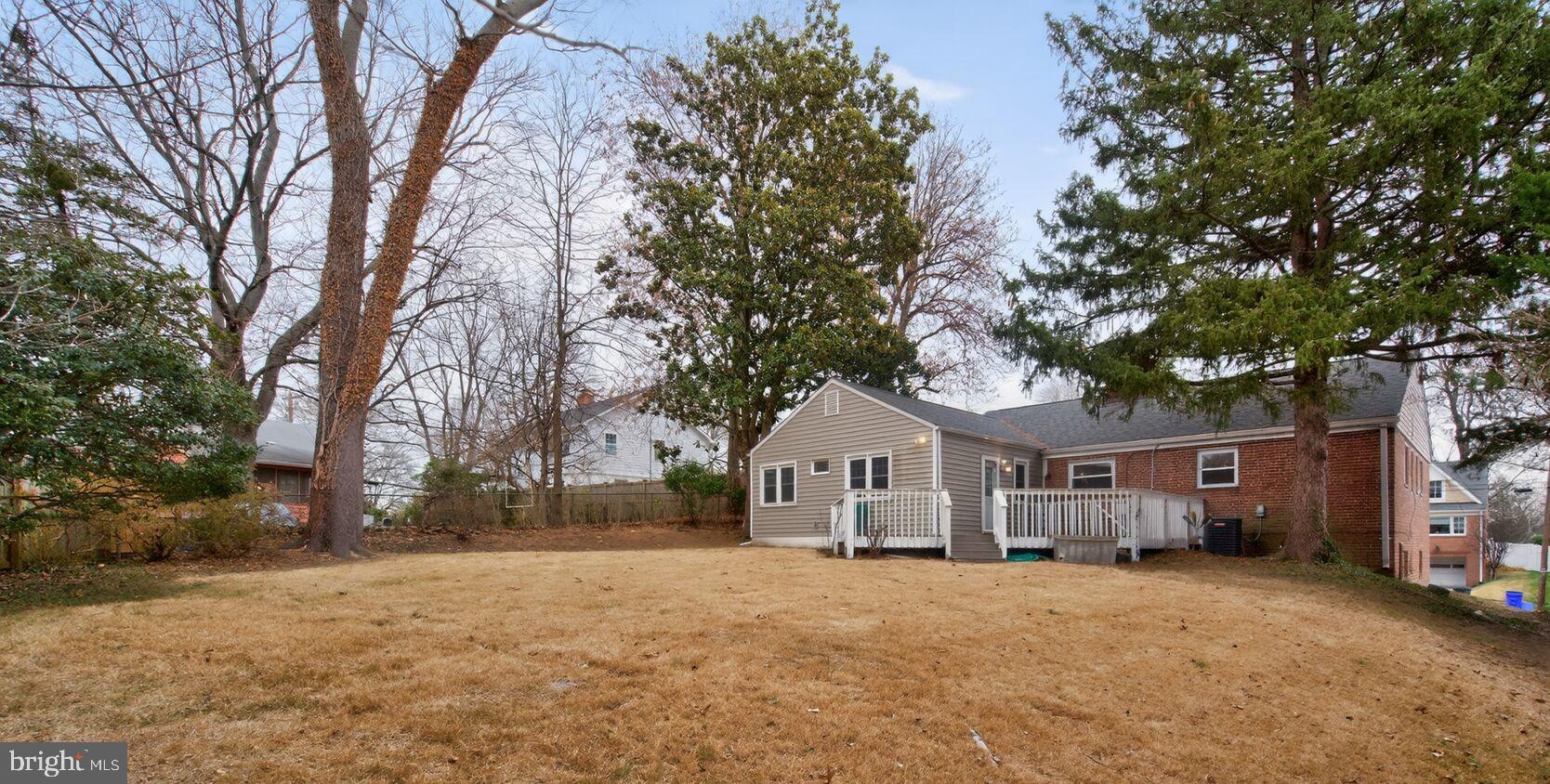 4503 Woodfield Road Kensington, MD 20895 - Photo 28 of 30 Spacious backyard with serene greenery.