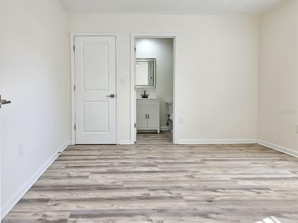 518 Northwest 27th Avenue Gainesville, FL 32609 - Photo 14 of 34 a view of an empty room with closet and mirror