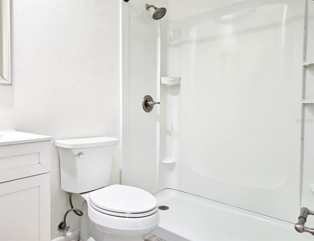 518 Northwest 27th Avenue Gainesville, FL 32609 - Photo 17 of 34 a white toilet sitting next to a shower