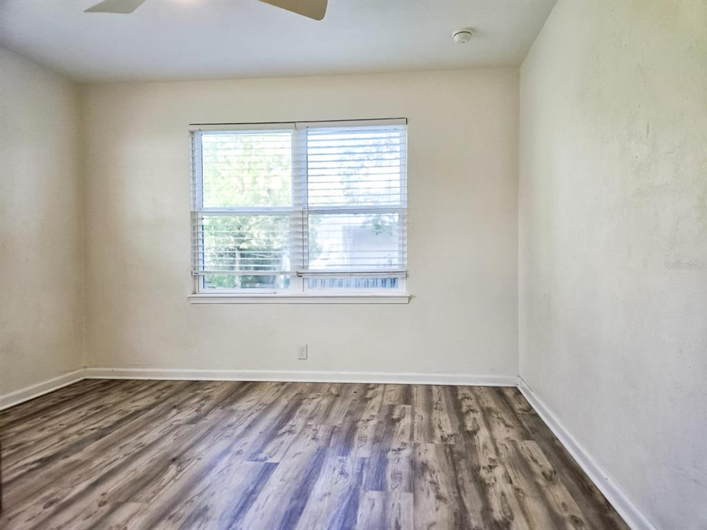 518 Northwest 27th Avenue Gainesville, FL 32609 - Photo 24 of 34 wooden floor in an empty room with a window