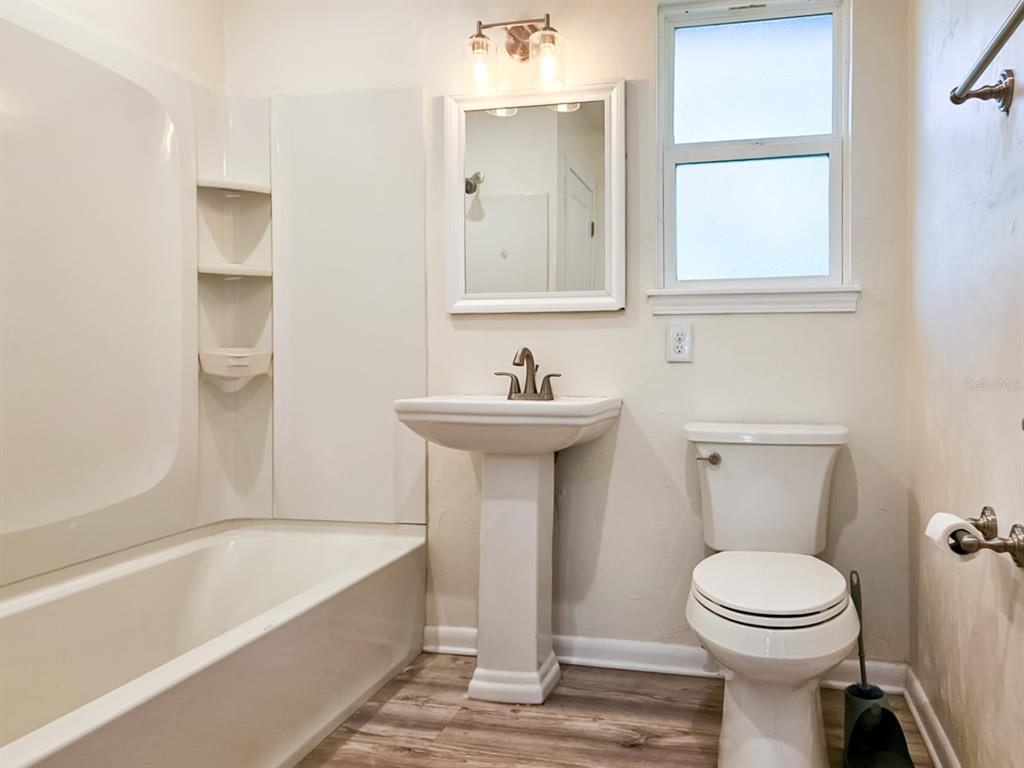 518 Northwest 27th Avenue Gainesville, FL 32609 - Photo 27 of 34 a bathroom with a sink a toilet and a bathtub