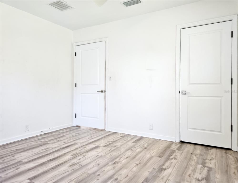 518 Northwest 27th Avenue Gainesville, FL 32609 - Photo 29 of 34 a view of a room with wooden floor