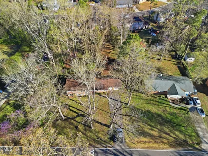 a aerial view of residential houses with yard